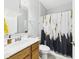 Updated bathroom featuring stylish shower curtain, vanity with sink, and modern fixtures at 6606 Colt Ln, Anderson, IN 46013