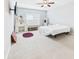 Bedroom featuring a ceiling fan, a vanity with a makeup mirror, and a flat screen tv at 6606 Colt Ln, Anderson, IN 46013