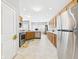 Bright kitchen featuring stainless steel appliances, tile backsplash, and plenty of cabinet space for easy organization at 6606 Colt Ln, Anderson, IN 46013