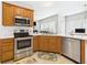 Well-equipped kitchen with stainless steel appliances, ample counter space, and stylish cabinetry for culinary enthusiasts at 6606 Colt Ln, Anderson, IN 46013