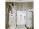 Home utility area featuring furnace, water heater, and essential systems at 6606 Colt Ln, Anderson, IN 46013