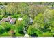 Charming home with mature trees, driveway, and well-maintained landscaping from an aerial view at 70 Williamsburg Ct, Zionsville, IN 46077