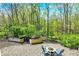 Backyard has a fire pit and seating, perfect for outdoor relaxation at 70 Williamsburg Ct, Zionsville, IN 46077