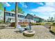 Backyard features a cozy fire pit area and lush landscaping at 70 Williamsburg Ct, Zionsville, IN 46077