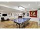 Finished basement featuring a ping pong table, bar, and fun decor at 70 Williamsburg Ct, Zionsville, IN 46077