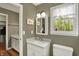 Well-lit bathroom with double vanity and a scenic view at 70 Williamsburg Ct, Zionsville, IN 46077