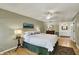 Spacious bedroom with ceiling fan and ensuite bathroom at 70 Williamsburg Ct, Zionsville, IN 46077