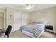 Spacious bedroom features a closet, ceiling fan, carpet, and bedside table at 70 Williamsburg Ct, Zionsville, IN 46077