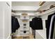 Walk-in closet with built-in shelves and rods for optimal organization at 70 Williamsburg Ct, Zionsville, IN 46077
