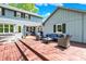 Two tiered backyard deck area with cozy seating to enjoy the outdoor weather at 70 Williamsburg Ct, Zionsville, IN 46077