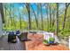 Wooden deck with seating, overlooking the wooded back yard at 70 Williamsburg Ct, Zionsville, IN 46077