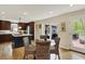 Eat-in kitchen features wood floors, stainless appliances, a large island, and sliding door access to the patio at 70 Williamsburg Ct, Zionsville, IN 46077