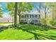 Beautifully landscaped two-story home with black shutters and a well-manicured lawn at 70 Williamsburg Ct, Zionsville, IN 46077