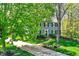 Charming two-story home with mature trees and a well-maintained front yard at 70 Williamsburg Ct, Zionsville, IN 46077