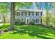 Inviting two-story home with neatly landscaped front yard at 70 Williamsburg Ct, Zionsville, IN 46077