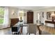 Bright home office with hardwood floors, large windows, and classic furnishings at 70 Williamsburg Ct, Zionsville, IN 46077