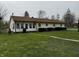 Home exterior with an expansive green lawn, offering plenty of room for outdoor enjoyment at 712 E Mckenzie Rd, Greenfield, IN 46140