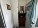 Bathroom with white tile wall and wooden cupboard at 712 E Mckenzie Rd, Greenfield, IN 46140