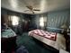 Cozy bedroom featuring carpeted floors and two windows for natural lighting at 712 E Mckenzie Rd, Greenfield, IN 46140