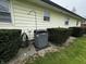 Home exterior showcasing the air conditioning unit, complemented by manicured shrubs at 712 E Mckenzie Rd, Greenfield, IN 46140