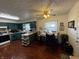 Kitchen with laminate flooring, dark cabinets, and a table with four chairs at 712 E Mckenzie Rd, Greenfield, IN 46140