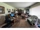 Bright living room with carpet, traditional furniture, and ample natural light at 712 E Mckenzie Rd, Greenfield, IN 46140