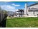 Large backyard featuring an outdoor gazebo, stone patio, and ample grass area at 717 Driftwood Cir, Danville, IN 46122