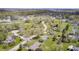 Expansive aerial view of a neighborhood showcasing well-maintained homes, lush trees, and serene surroundings at 7170 Janean Dr, Brownsburg, IN 46112