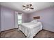Cozy bedroom featuring neutral colors, a bed with white linens, and a ceiling fan at 7170 Janean Dr, Brownsburg, IN 46112