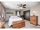 Comfortable bedroom with a ceiling fan, bed with white linens, and ample natural light at 7170 Janean Dr, Brownsburg, IN 46112