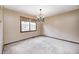 Cozy dining room featuring carpet flooring, chandelier lighting, and a window view at 7170 Janean Dr, Brownsburg, IN 46112