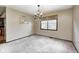 Traditional dining room featuring carpet flooring, a chandelier, and a window for natural lighting at 7170 Janean Dr, Brownsburg, IN 46112