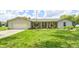 Charming ranch home featuring a stone facade, a well-manicured lawn, and an attached two-car garage at 7170 Janean Dr, Brownsburg, IN 46112