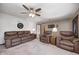Cozy living room featuring plush seating, ceiling fan, and neutral décor at 7170 Janean Dr, Brownsburg, IN 46112