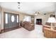 Inviting living room with plush carpeting, comfortable seating, and ample natural light filtering through the windows at 7170 Janean Dr, Brownsburg, IN 46112