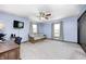 Living room featuring a futon, a desk, neutral-colored walls, and ample space at 7170 Janean Dr, Brownsburg, IN 46112