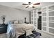 Bright bedroom featuring large closets, neutral walls, carpet, and a comfortable bed with bedside tables at 731 Oak Dr, Greenwood, IN 46142