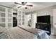 A beautifully designed bedroom with ample storage, a ceiling fan, and a modern entertainment unit at 731 Oak Dr, Greenwood, IN 46142