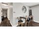 View of the dining area with a wood table, dark-colored floors, and an elaborate wall mirror decoration at 731 Oak Dr, Greenwood, IN 46142