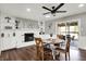 Cozy dining area with a white brick fireplace, built-in shelves, and a sliding glass door that leads outside at 731 Oak Dr, Greenwood, IN 46142
