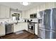 Well-equipped kitchen with stainless steel appliances, sleek countertops, and tiled backsplash at 731 Oak Dr, Greenwood, IN 46142