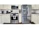 Bright kitchen with stainless steel appliances and countertops with tiled backsplash at 731 Oak Dr, Greenwood, IN 46142