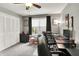 Home office with built-in shelves, modern desk setup, a window with natural light, and large closet at 731 Oak Dr, Greenwood, IN 46142