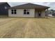 Rear exterior of home with covered patio and newly seeded backyard at 7533 Big Bend Blvd, Camby, IN 46113