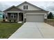Charming single-story home with a two-car garage, stone accents, and a well-manicured front yard at 7533 Big Bend Blvd, Camby, IN 46113