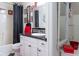 Bathroom featuring a shower-tub combination, and a white vanity with a black countertop at 7594 W Williamswood Dr, New Palestine, IN 46163
