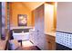 Bathroom featuring free standing tub, cabinets, and decor at 7594 W Williamswood Dr, New Palestine, IN 46163