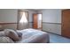 Cozy bedroom features plush carpeting, natural light, and soothing color scheme at 7825 N County Road 650 E, Brownsburg, IN 46112