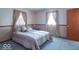 Comfortable bedroom with soft carpet, natural light from window, and warm beige walls at 7825 N County Road 650 E, Brownsburg, IN 46112