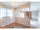 Dining area with large windows and decorative chandelier at 7825 N County Road 650 E, Brownsburg, IN 46112